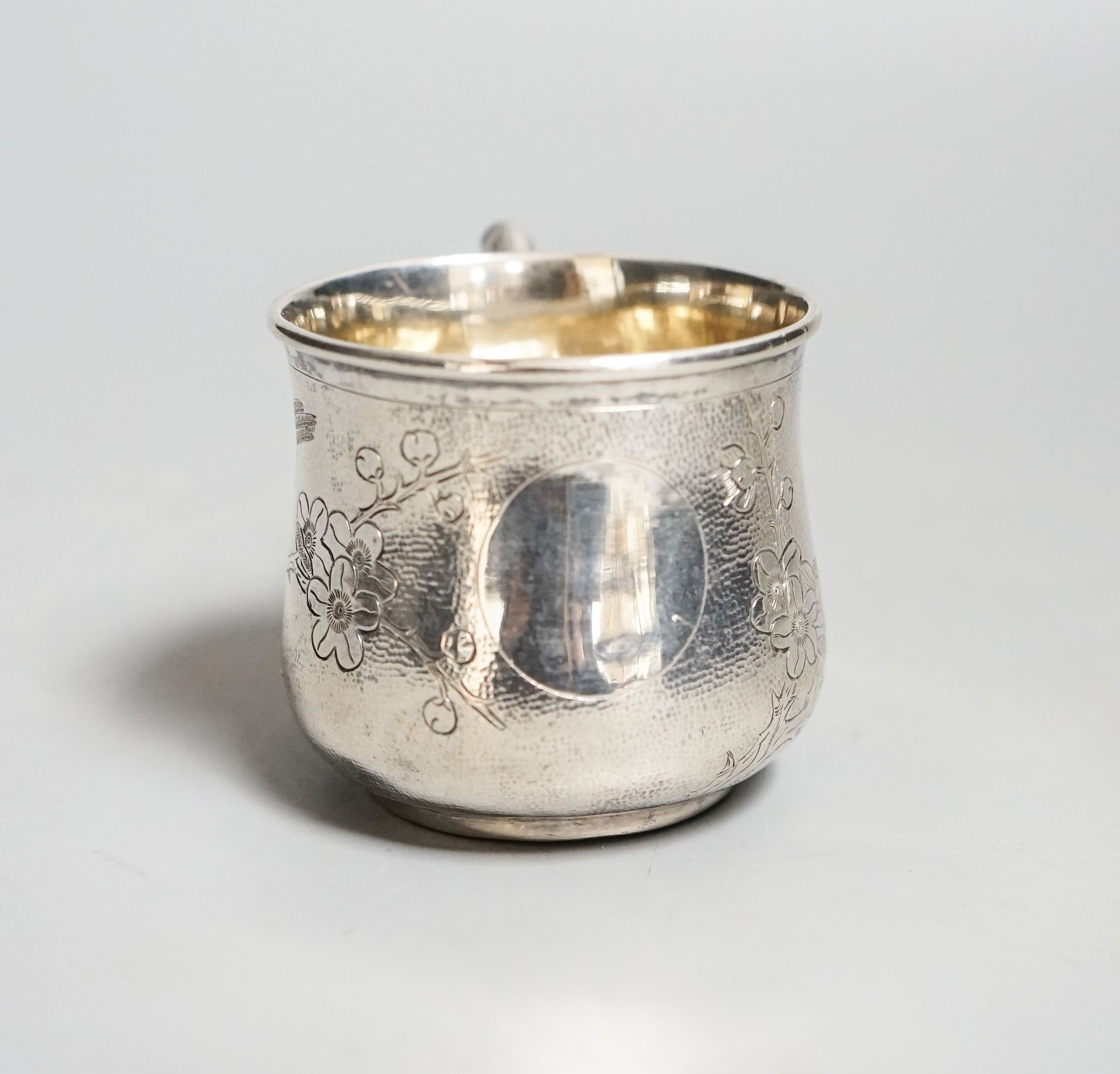 A Chinese white metal christening mug, by Zee Sung, 55mm.